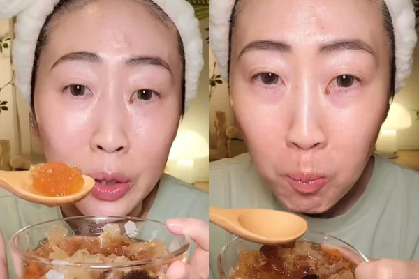 Foto colorida de uma mulher comendo - Metrópoles