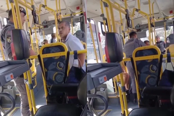 Imagem colorida de motorista sendo abordado pela PM em ônibus. Metrópoles