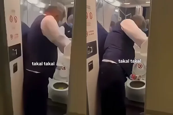 Um funcionário retirando os dejetos de um dos banheiros do avião