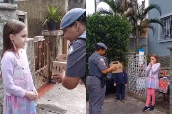 Foto colorida de um policial e uma menina - Metrópoles