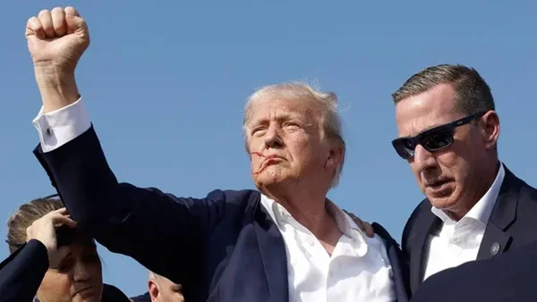 imagem colorida donald trump e sean curran