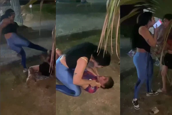 Mulher segura outra mulher, enforcando-a, sobre gramado - Metrópoles