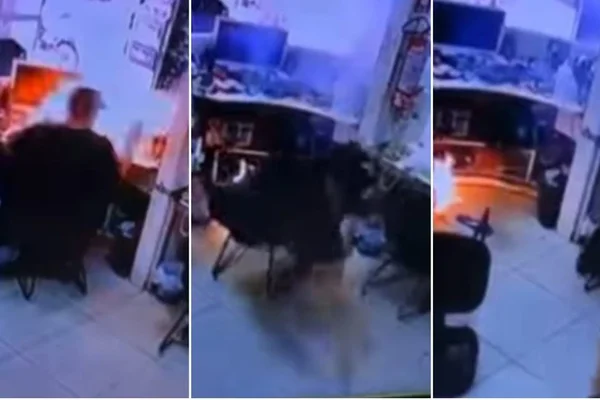 Imagem mostra o momento em que bateria de celular nas mãos de técnico, formando uma bola de fogo - Metrópoles