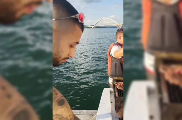 Homens fazendo churrasco no lago