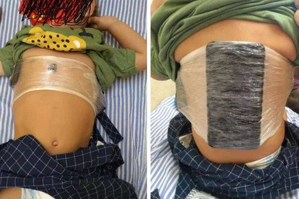 Mulher esconde celular sob roupa de criança para entregar a preso