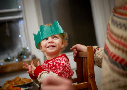 Toddler enjoying Christmas dinner.