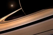 Ilustração mostra os aneis de saturno em perspectiva, onde estão as luas encontradas no novo estudo Ilustração mostra os aneis de saturno em perspectiva, onde estão as luas encontradas no novo estudo