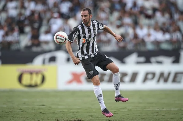 Imagem colorida de Godín pelo Atlético Mineiro