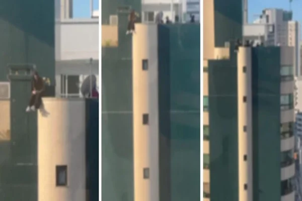 Imagem colorida, adolescente topo de prédio SC - Metrópoles