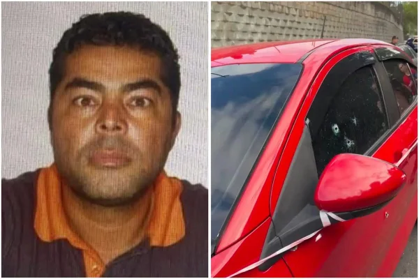 homem ao lado de carro atingido