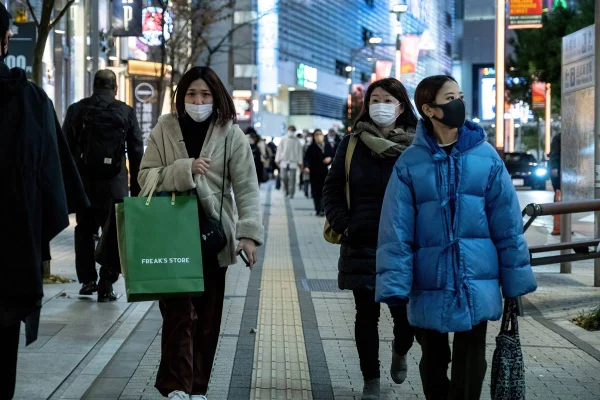People seen walking on the streets wearing facemasks as a