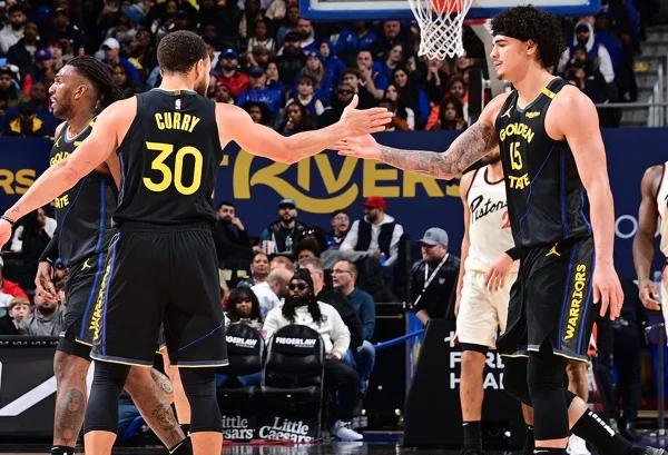 Imagem colorida de Stephen Curry cumprimentando Gui Santos - Metrópoles