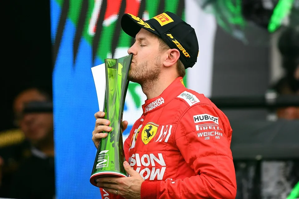 MEXICO CITY, MEXICO - OCTOBER 27: Second placed Sebastian Vettel of Germany and Ferrari celebrates on the podium during the F1 Grand Prix of Mexico at Autodromo Hermanos Rodriguez on October 27, 2019 in Mexico City, Mexico. (Photo by Clive Mason/Getty Images) MEXICO CITY, MEXICO - OCTOBER 27: Second placed Sebastian Vettel of Germany and Ferrari celebrates on the podium during the F1 Grand Prix of Mexico at Autodromo Hermanos Rodriguez on October 27, 2019 in Mexico City, Mexico. (Photo by Clive Mason/Getty Images)