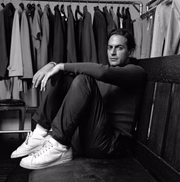 Portrait of Marc Jacobs amid racks of clothes (Photo by Fairchild Archive/Penske Media via Getty Images)