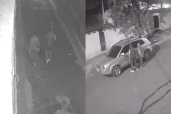 Imagem colorida de dupla abandonando carro de professora morta em SP