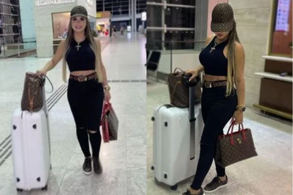 Deolane Bezerra posa em um aeroporto com sua roupa e bolsa da Louis Vuitton