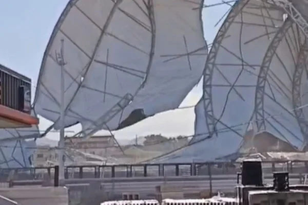Imagens coloridas mostram tenda caindo por causa de rajada de vento