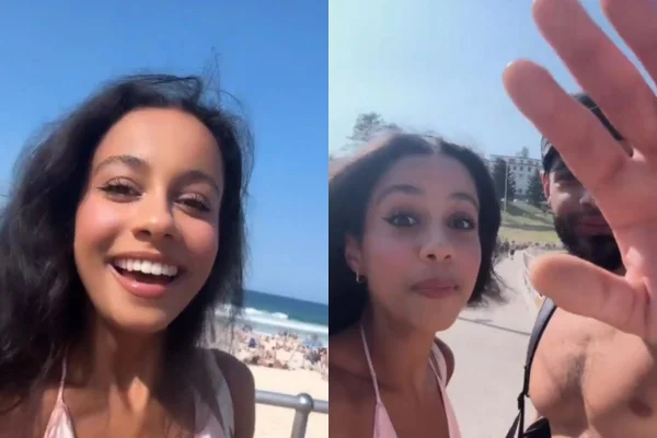 Foto colorida de uma mulher na praia - Metrópoles