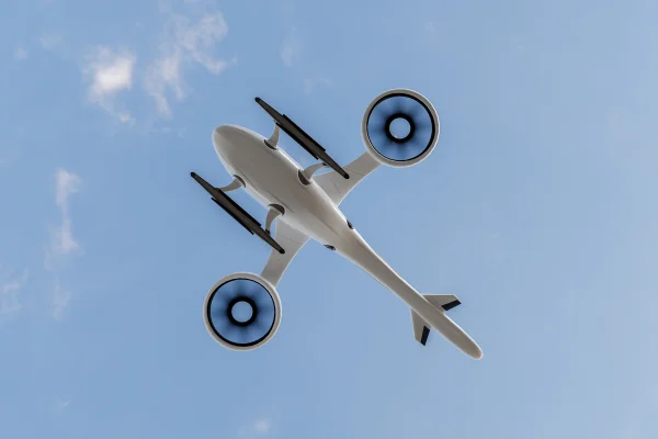 Foto colorida - Avião elétrico no céu