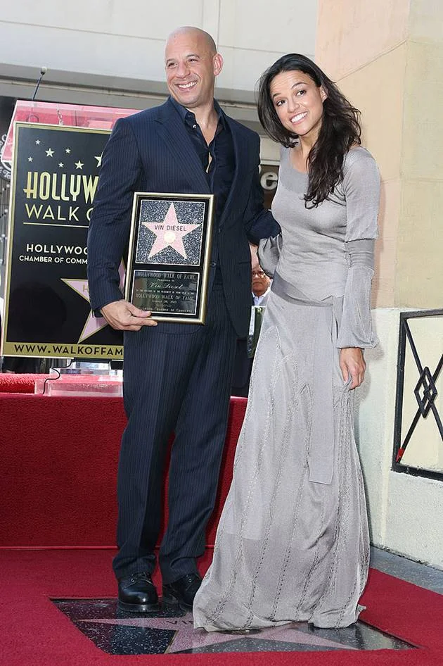 HOLLYWOOD, CA - AUGUST 26: Actor Vin Diesel (L) and actress Michelle Rodriguez pose during ceremony honoring him on The Hollywood Walk of Fame on August 26, 2013 in Hollywood, California. (Photo by Frederick M. Brown/Getty Images) HOLLYWOOD, CA - AUGUST 26: Actor Vin Diesel (L) and actress Michelle Rodriguez pose during ceremony honoring him on The Hollywood Walk of Fame on August 26, 2013 in Hollywood, California. (Photo by Frederick M. Brown/Getty Images)