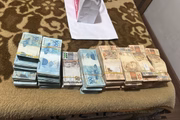 Dinheiro encontrado em casa de fiscal Artur Gomes da Silva Neto, investigado por corrupção