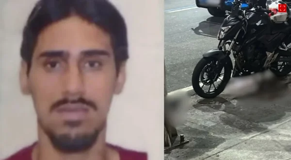 homem ao lado de cena de crime