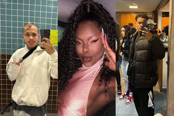 Vitão está com um casaco branco, cabelo moicano descolorido e uma bolsa. Suelen Gervásio está de rosa, é negra e tem o cabelo preto. Matuto está todo de preto, e tem o cabelo preto - Metrópoles