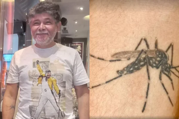 Foto mostra homem de meia idade com camiseta de banda de rock sorrindo para a câmera montada ao lado de um foco em sua tatuagem