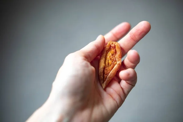 Pêssego seco em forma de vagina