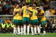 Jogadores da Austrália comemoram segundo gol Jogadores da Austrália comemoram segundo gol