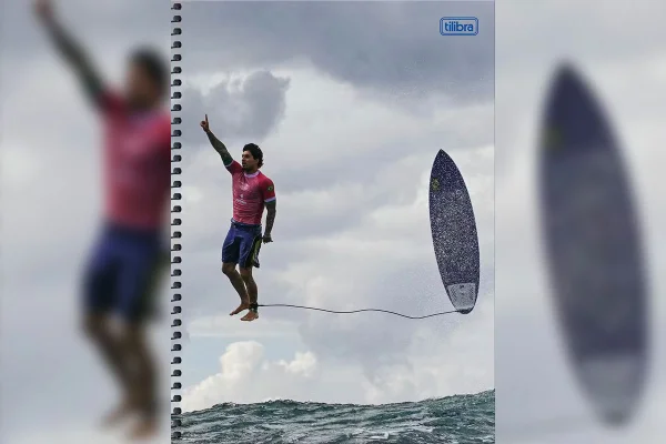 Imagem colorida de capa de caderno com foto estampada que mostra o surfista Gabriel Medina de pé, suspenso sobre o mar - Metrópoles