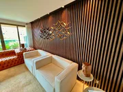 A sala de estar é ideal para receber amigos e familiares A sala de estar é ideal para receber amigos e familiares