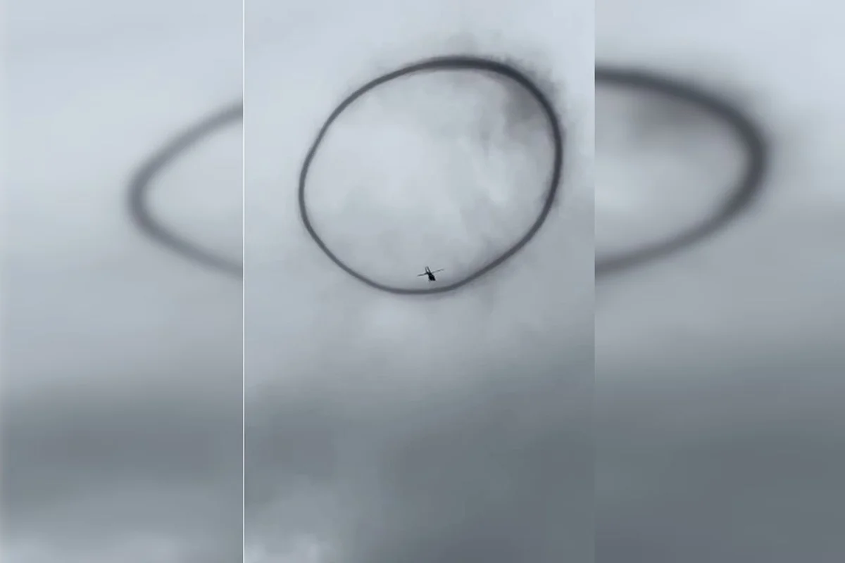 Halo solar forma círculo perfeito ao redor de helicóptero da PF em operação no Rio Madeira