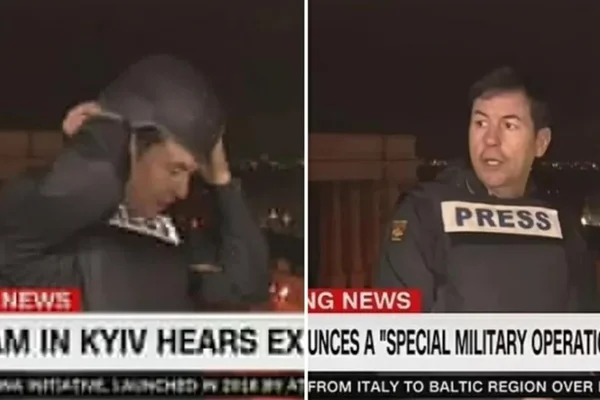 Repórter da CNN Internacional se desespera com explosões após Rússia atacar Ucrânia. Em imagens justapostas, o jornalista é visto colocando colete e capacete em ambiente externo - Metrópoles