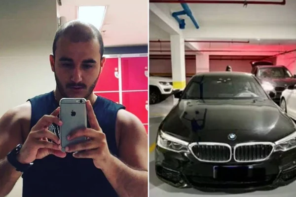 Homem fazendo selfie ao lado de BMW