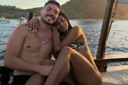 Poka and Ronan Souza pose in a romantic setting