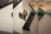 Munições e dinheiro apreendidos
