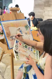 Artista Lu Oliveira faz pintura em aquarela durante casamento