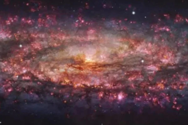 Esta imagem da Galáxia do Escultor está fornecendo aos astrônomos informações detalhadas sobre uma variedade de estrelas, nebulosas e regiões de intensa formação de novas estrelas European Southern Observatory