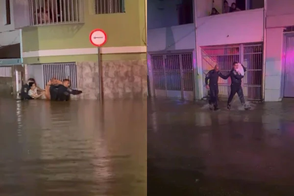 A mulher e as filhas estavam ilhadas em uma enchente na Penha, zona leste de São Paulo. A água atingiu 1,5 metro dentro da casa da família - Metrópoles