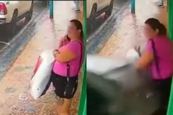 Imagem colorida de uma mulher sendo atropelada por um carro em frente a uma loja - Metrópoles