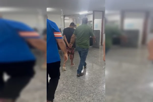 Imagem colorida de homem sendo preso no DF