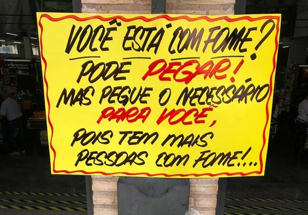 “Está com fome? Pode pegar”, oferece comerciante a necessitados