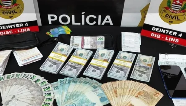 Imagem colorida de dinheiro apreendido no golpe do bilhete premiado
