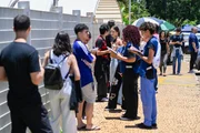 Students waiting for the gates to open on the first day of the national high school entrance exam (Enem)