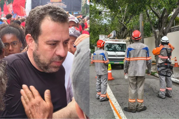 Imagem colorida mostra ministro Guilherme Boulos e trabalhadores da Enel. São Paulo