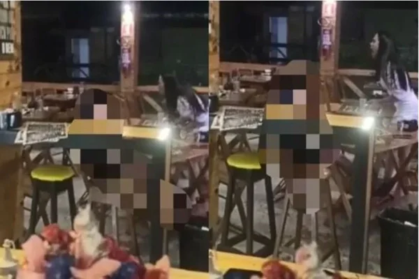 Imagem colorida e embaçada do bar onde ocorreu o crime