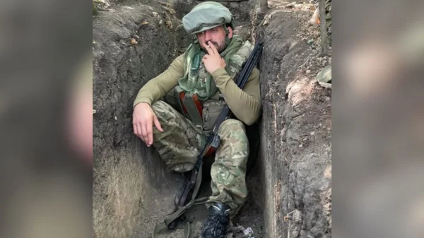 Imagem colorida de Tomasz Walentek na guerra