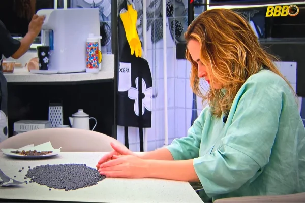 Participante Ana Paula do BBB 26 catando feijão