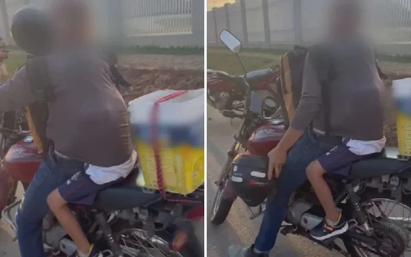 imagem colorida menino moto sem capacete na camisa do pai